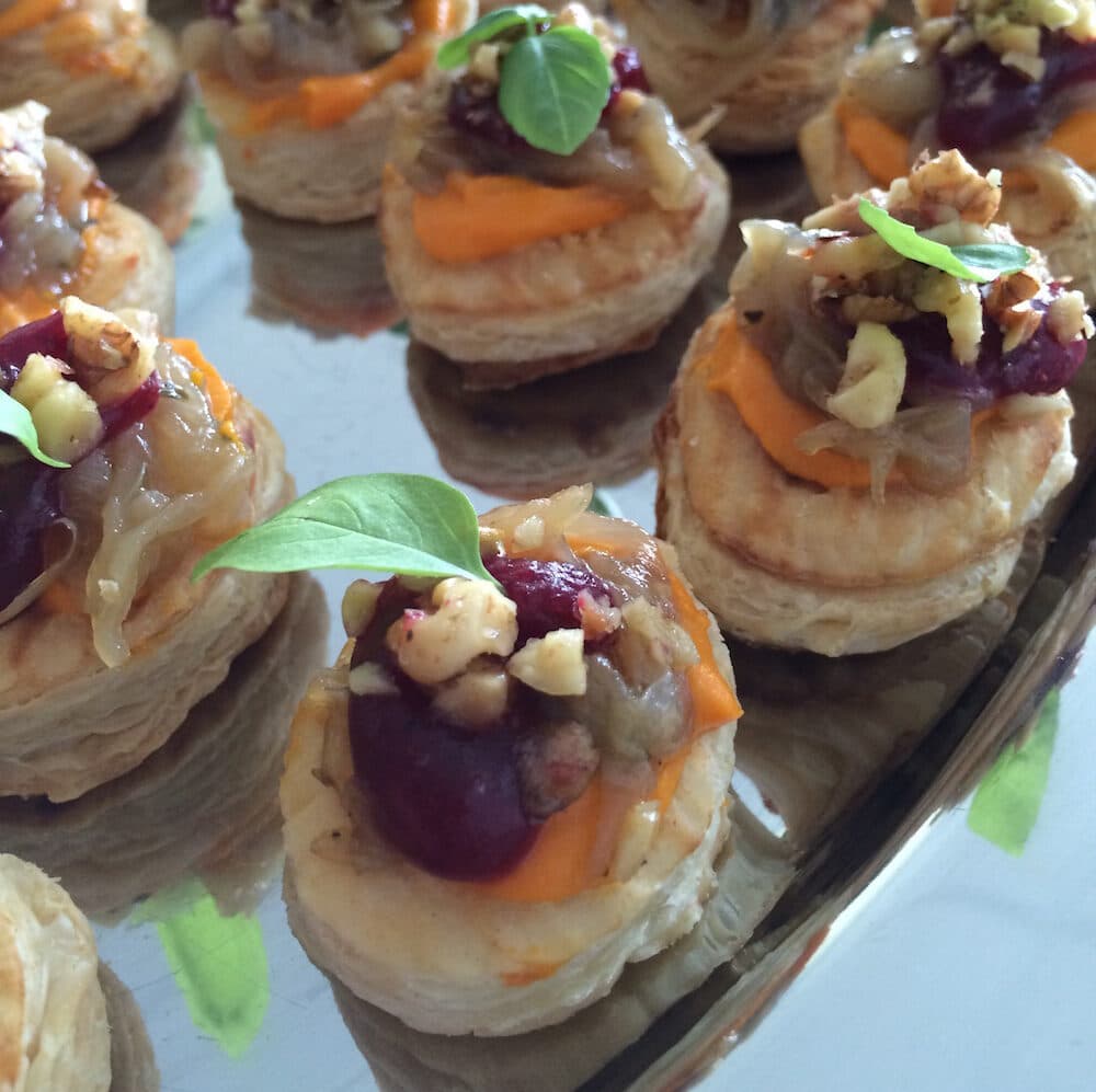 Puff pastry, yam goats cheese puree, caramelized onion, cranberry jelly, crushed walnuts, and basil
